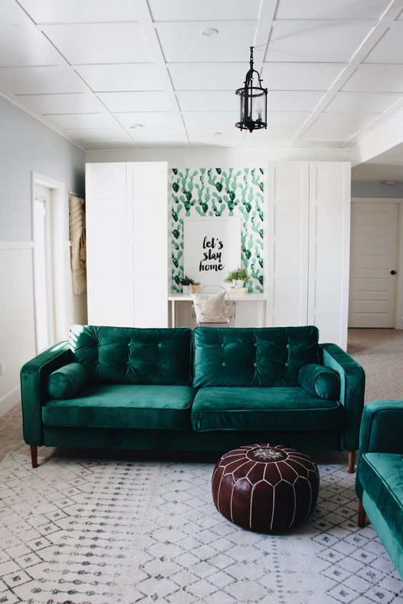Dark Tufted Velvet Sofa Anchors a Cactus Print Wall