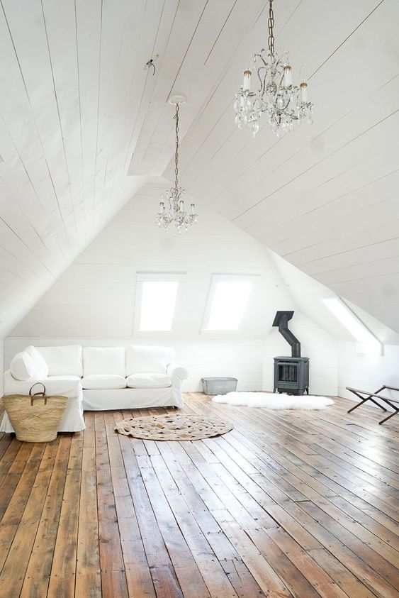Two Crystal Chandeliers Add Glamour To A Sloped Ceiling