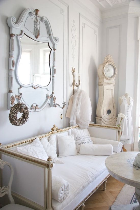 Cream Grandfather Clock With Ornate Crown and Decorative Finials