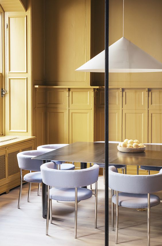 Light Blue Upholstered Chairs Soften a Dark Dining Table