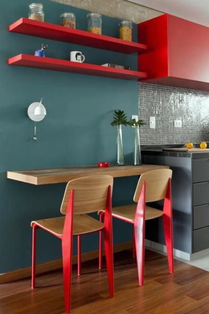 Wall-Mounted Countertop With Bright Red Chair Legs