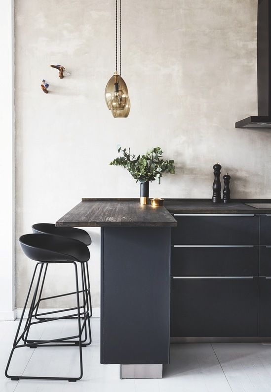 Amber Glass Pendants Add Warmth to Dark Island