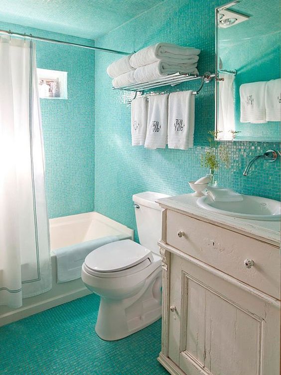 Towel Rack With Stacked Towels and Hanging Hand Towels
