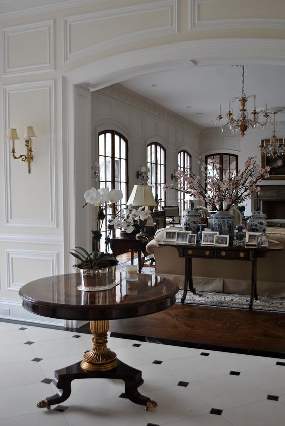 Ground Your Entryway with a Dark Wood Table and Gold Base