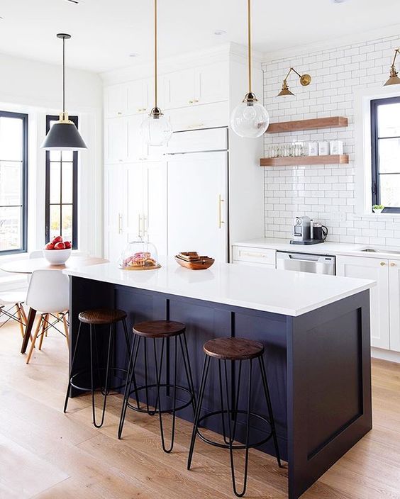 Balance a Dark Navy Island with Warm Wood Stools