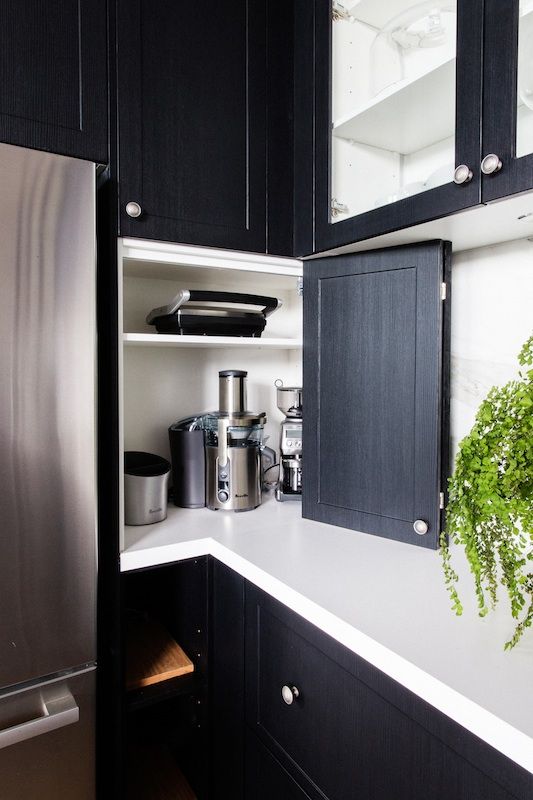 Appliance Nook With Cabinet Doors for a Clean Countertop