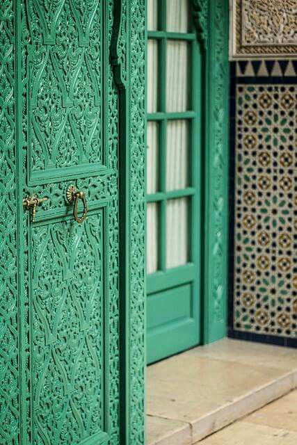 Intricately Carved Green Doors Add Rich Texture