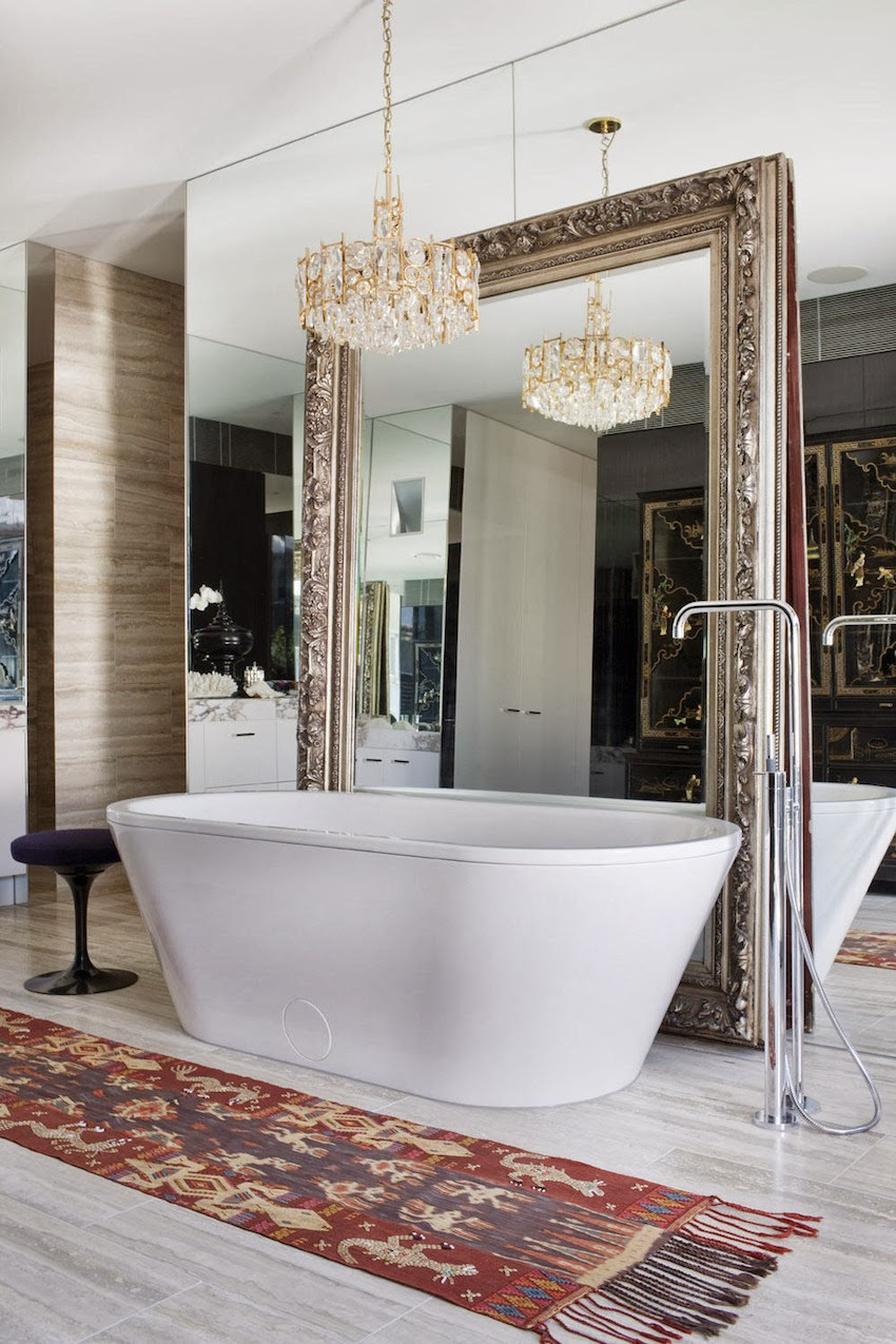 Ornate Mirror Frames a Freestanding Tub for Dramatic Effect