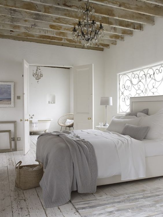 Exposed Wooden Beams Add Rustic Charm to a White Room