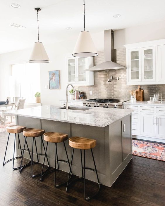 Ground Your Space with a Gray Island, Wood Stools, and Marble Top