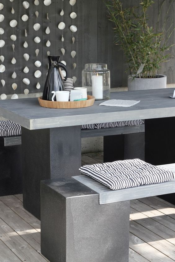 Dark Concrete Dining Set With Black and White Striped Cushions