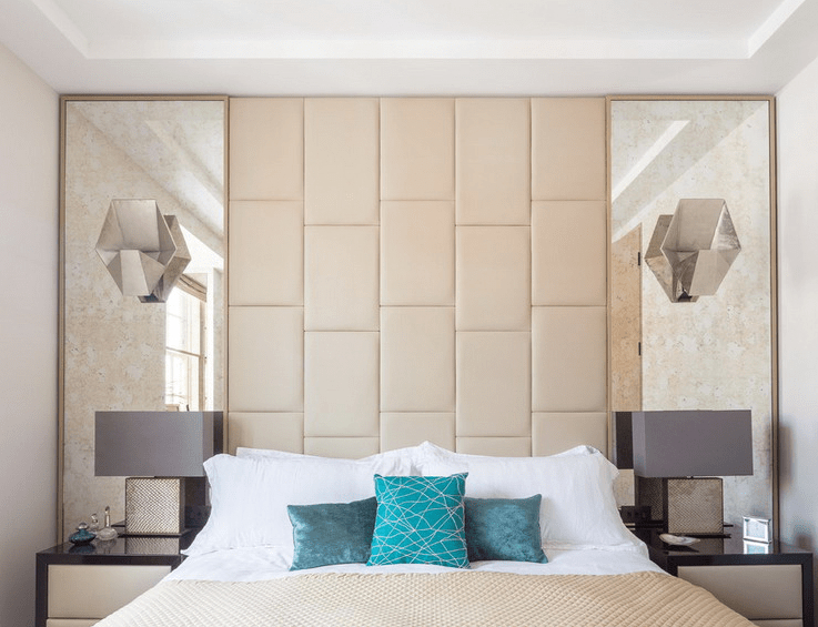 Tall Antiqued Mirrors Flanking Headboard Add Subtle Shine