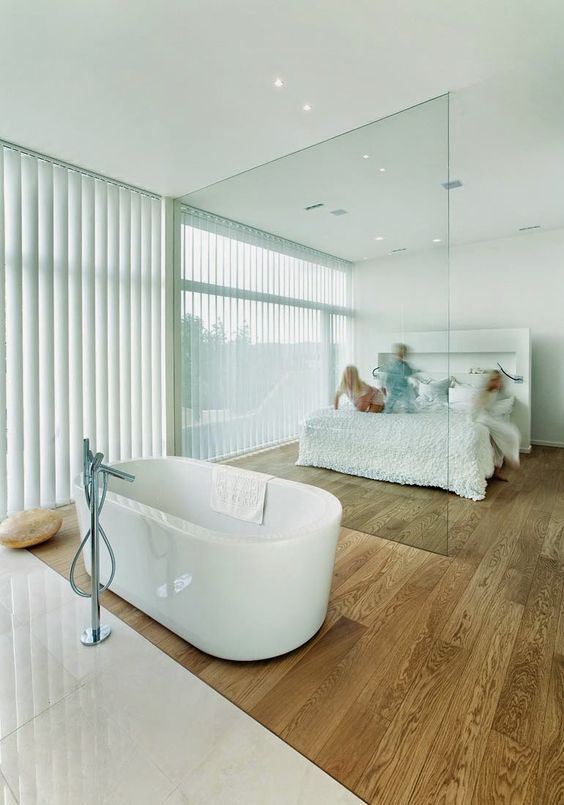 Freestanding Tub Placed on Wood Flooring Creates a Spa-Like Contrast