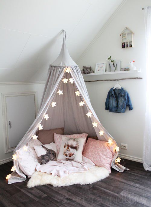 Star String Lights Add Whimsy to a Canopy Hideaway