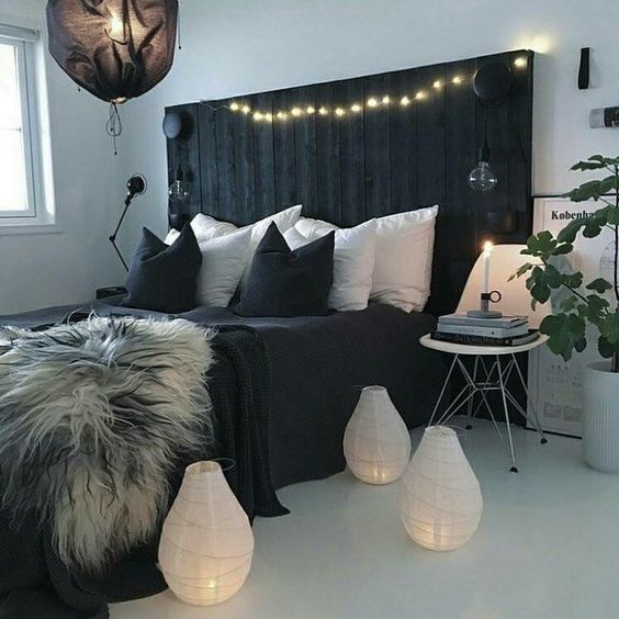 Dark Wood Paneling Behind Bed Creates a Moody Backdrop