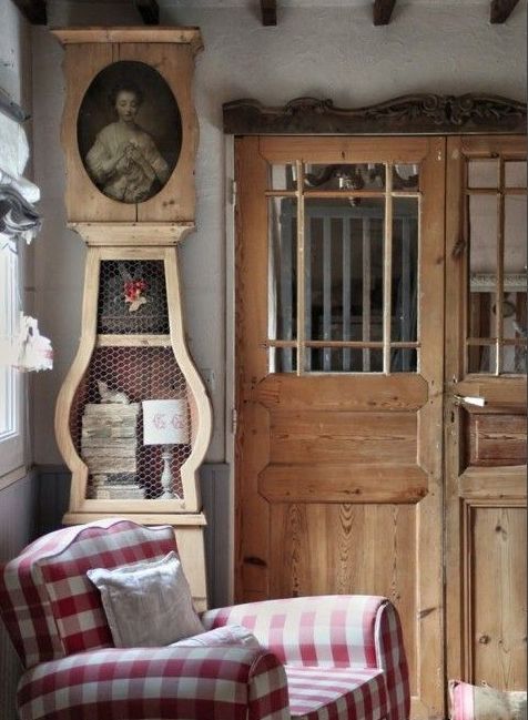 Light Wood Grandfather Clock With Oval Portrait and Chicken Wire Display