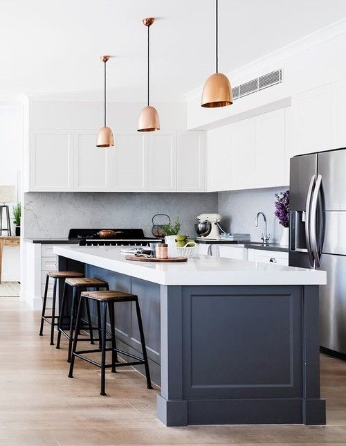 Ground Your White Kitchen with a Deep Gray Paneled Island