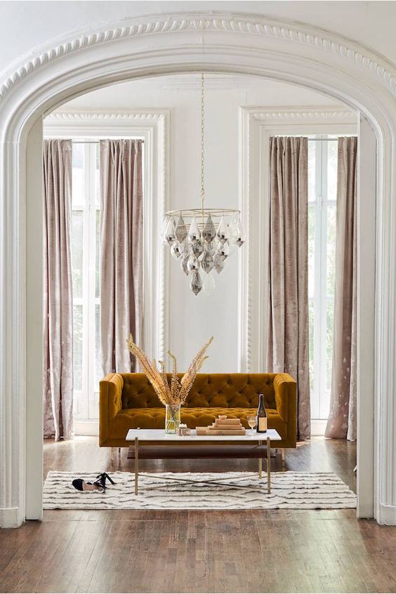 Deep Mustard Velvet Sofa Anchors a Chic Living Space