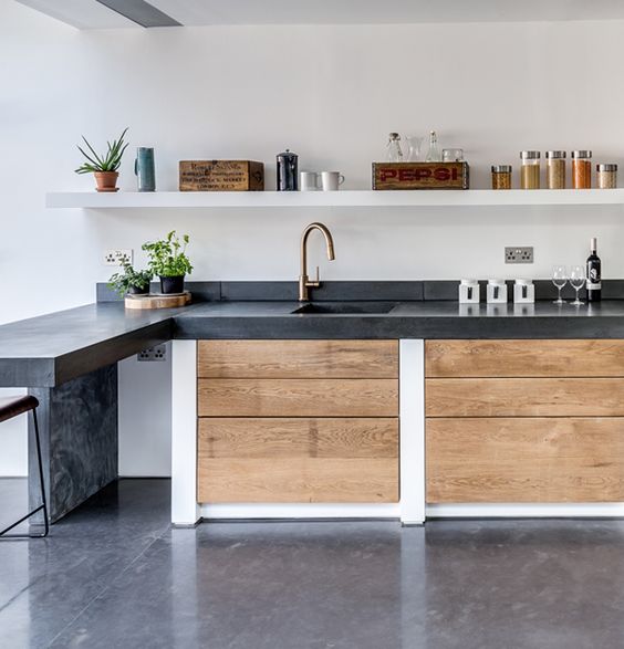 Wood Grain Drawer Fronts Soften Concrete Kitchen Cabinets