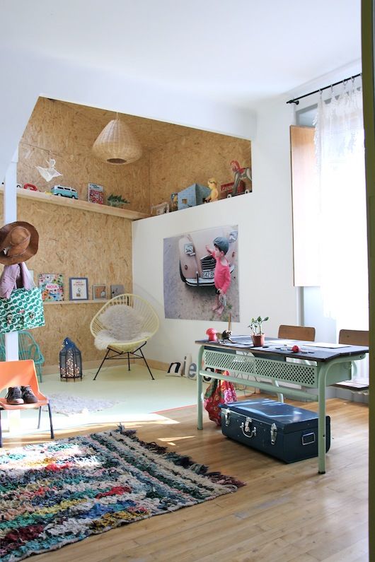 Wall-Mounted Shelves Displaying Children's Books and Toys