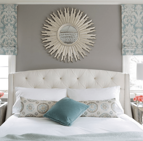 Sunburst Mirror Adds a Radiant Focal Point Above the Bed