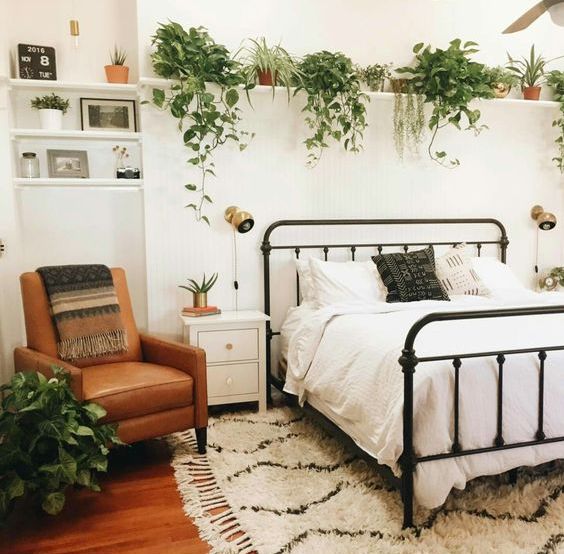 Cascading Greenery Softens Shelves Above the Bed