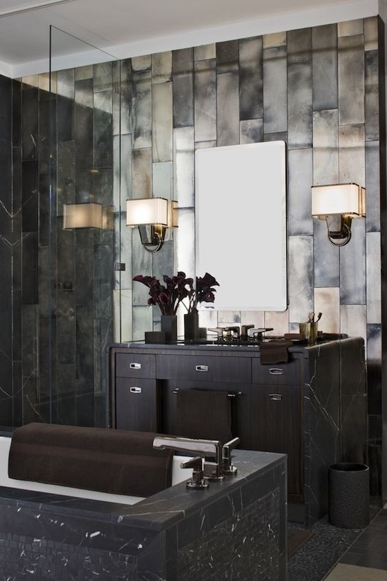 Dark Stone Walls Add Dramatic Texture To A Moody Bathroom