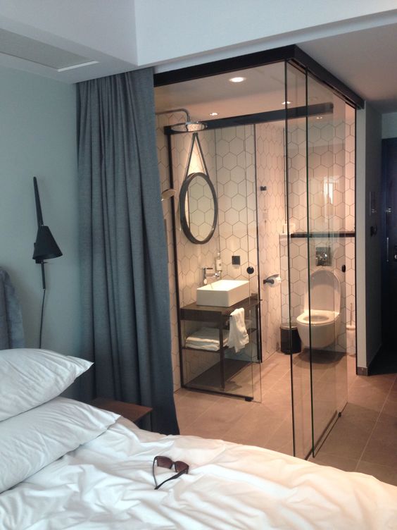 Visually Expand Your Bedroom with a Glass-Enclosed Bathroom