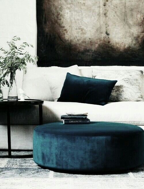 Round Teal Velvet Ottoman Doubles as a Coffee Table