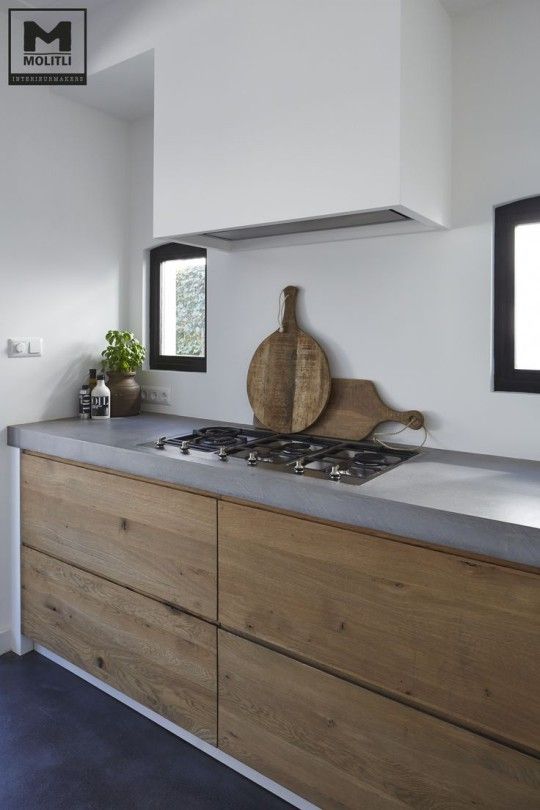 Wooden Cutting Boards Lean Against Backsplash