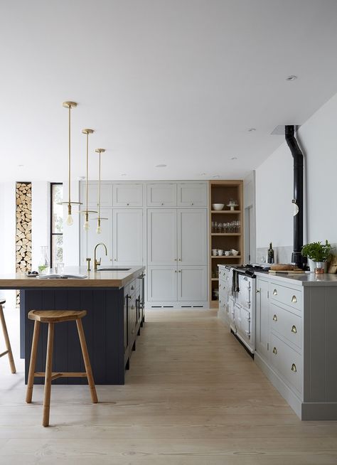 Ground Your Space with a Dark Navy Island, Wood Top, and Stools