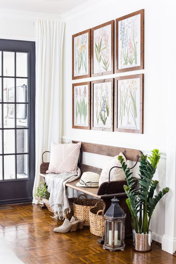 Botanical Prints Above a Wooden Bench Create a Gallery Wall