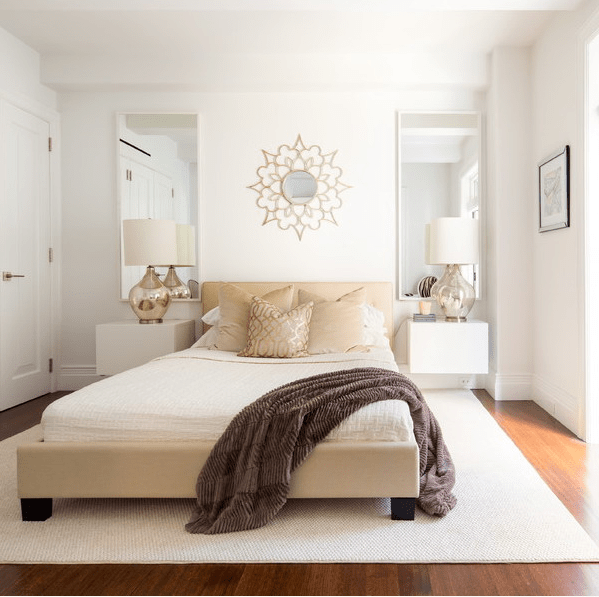 Tall Rectangular Mirrors Add Vertical Interest Beside the Bed