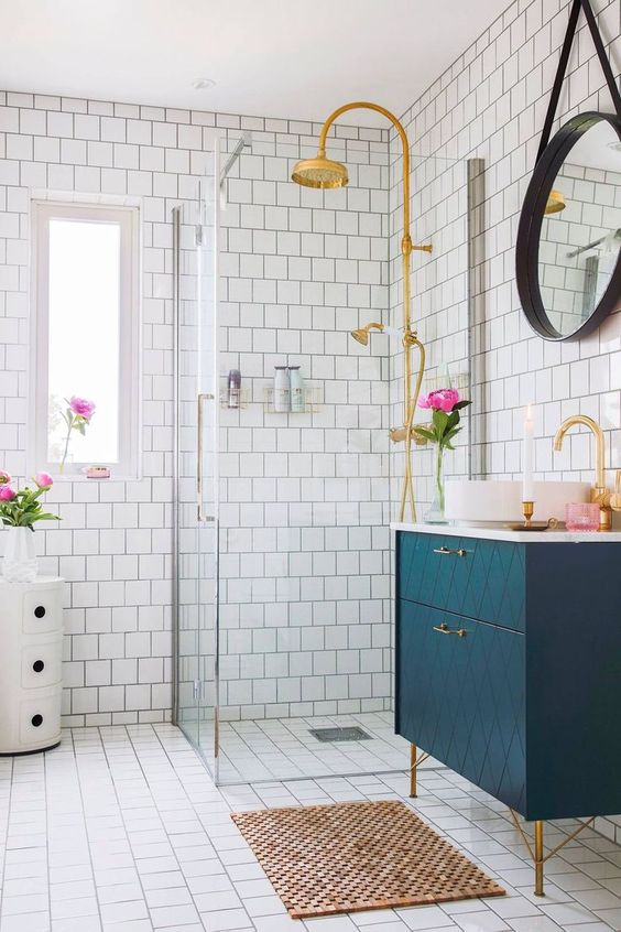 Gold Shower Fixtures Add Warmth to White Subway Tile
