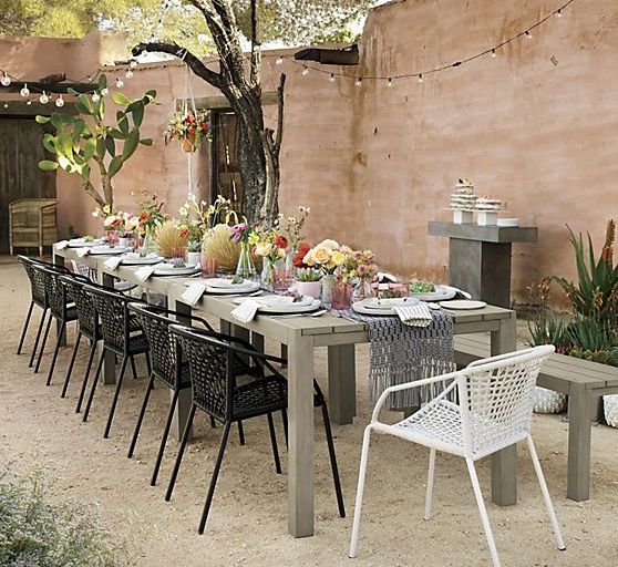 Woven Chairs Add Textural Interest to a Long Table