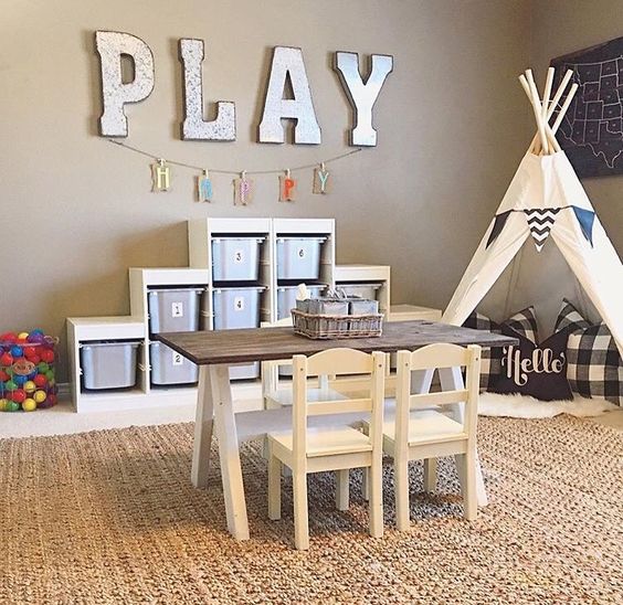 Large Metal Letters Spell Out 'PLAY' Above a Banner