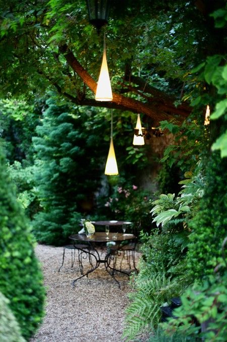 Cone-Shaped Pendant Lights Add Whimsical Ambiance to Garden Dining