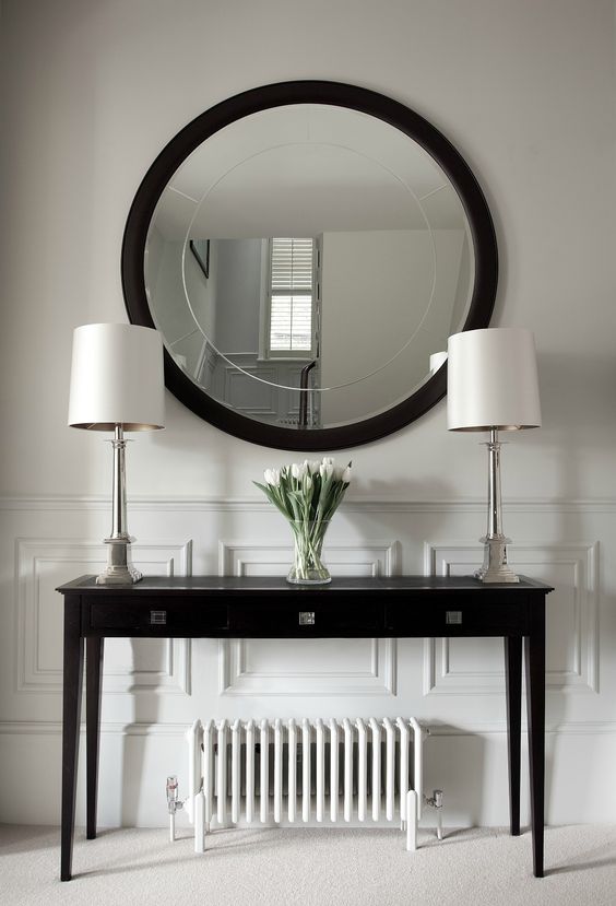 Dark Console Table With Matching Lamps and Tulips