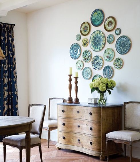 Group Decorative Plates Above a Dresser for Patterned Texture