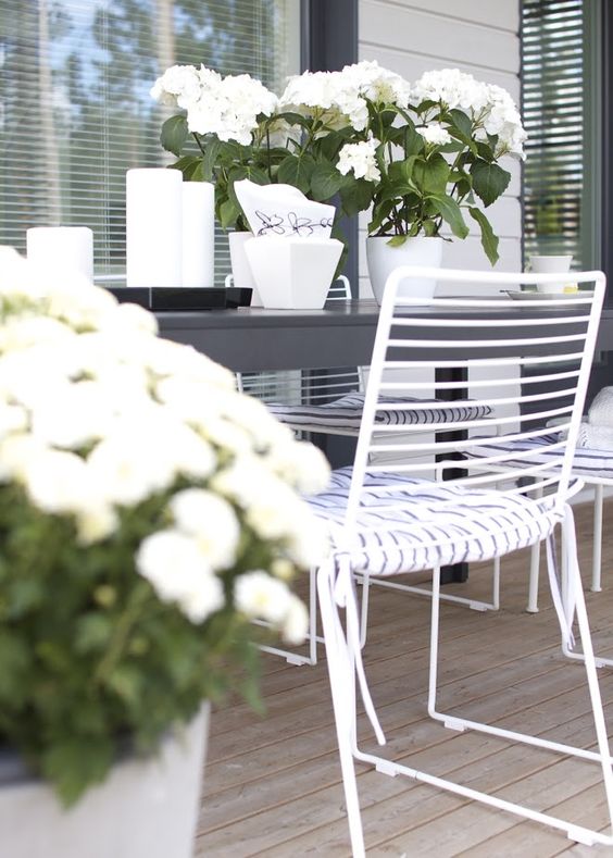 White Metal Chairs With Striped Cushions for a Fresh Look