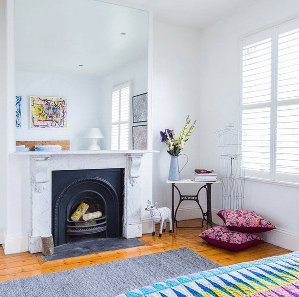 Brighten Your Fireplace Area with a Large Mirror Reflecting Artwork