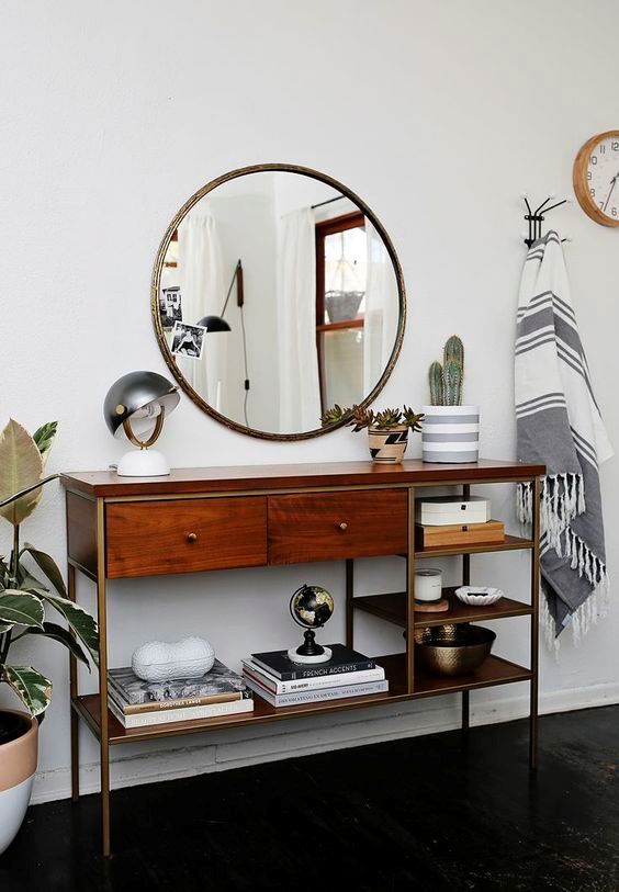 Reflect Light with a Round Metal Mirror Above a Wood Console