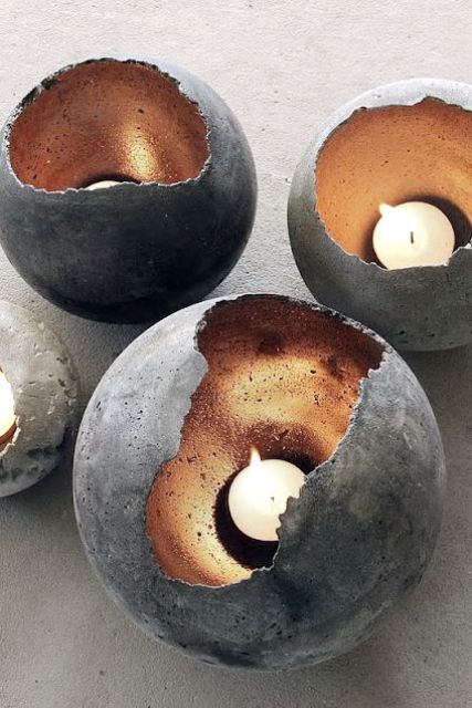 Rough-Hewn Concrete Candle Holders Cast Warm Glow