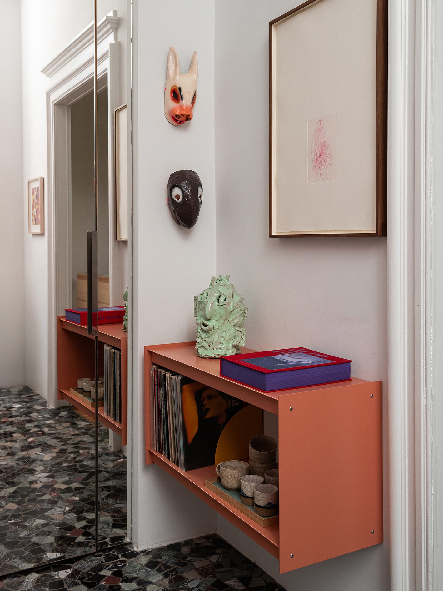 Coral Wall Shelves for Displaying Records and Mugs