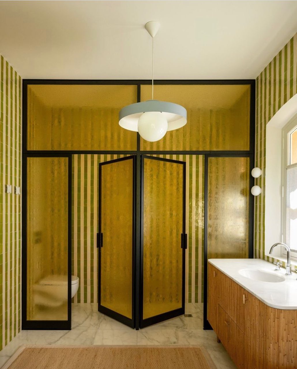 Frosted Yellow Glass Creates a Vibrant Shower Enclosure