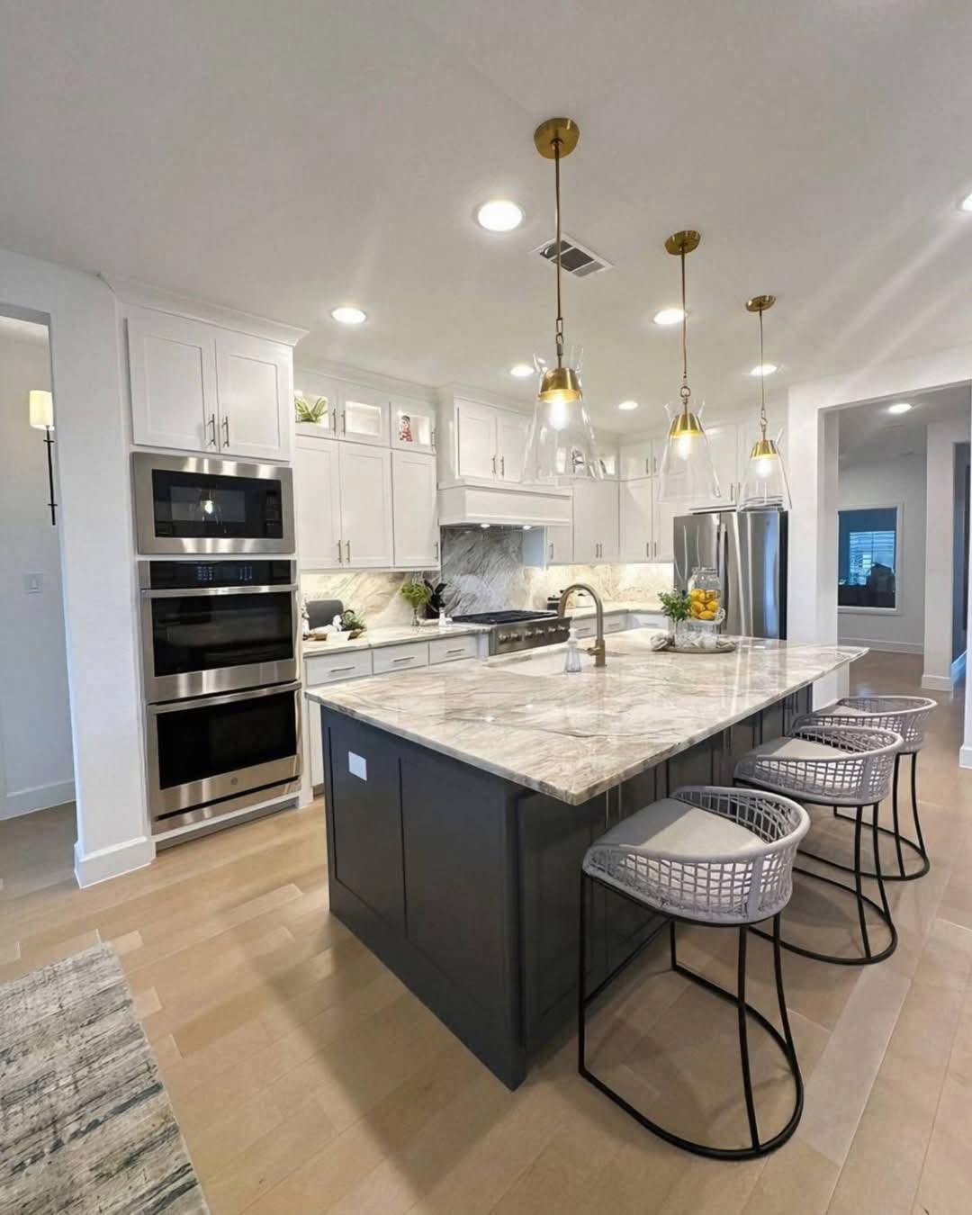 Dark Island Base Anchors a Marble Countertop