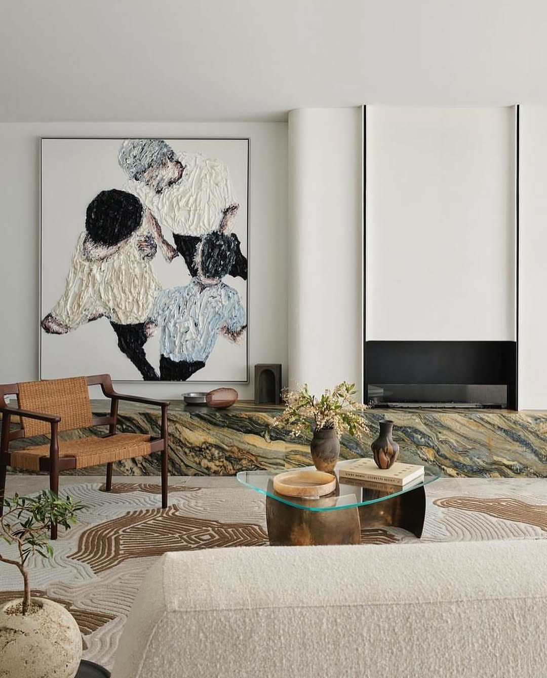 Woven Rattan Chair Adds Natural Texture Beside Art