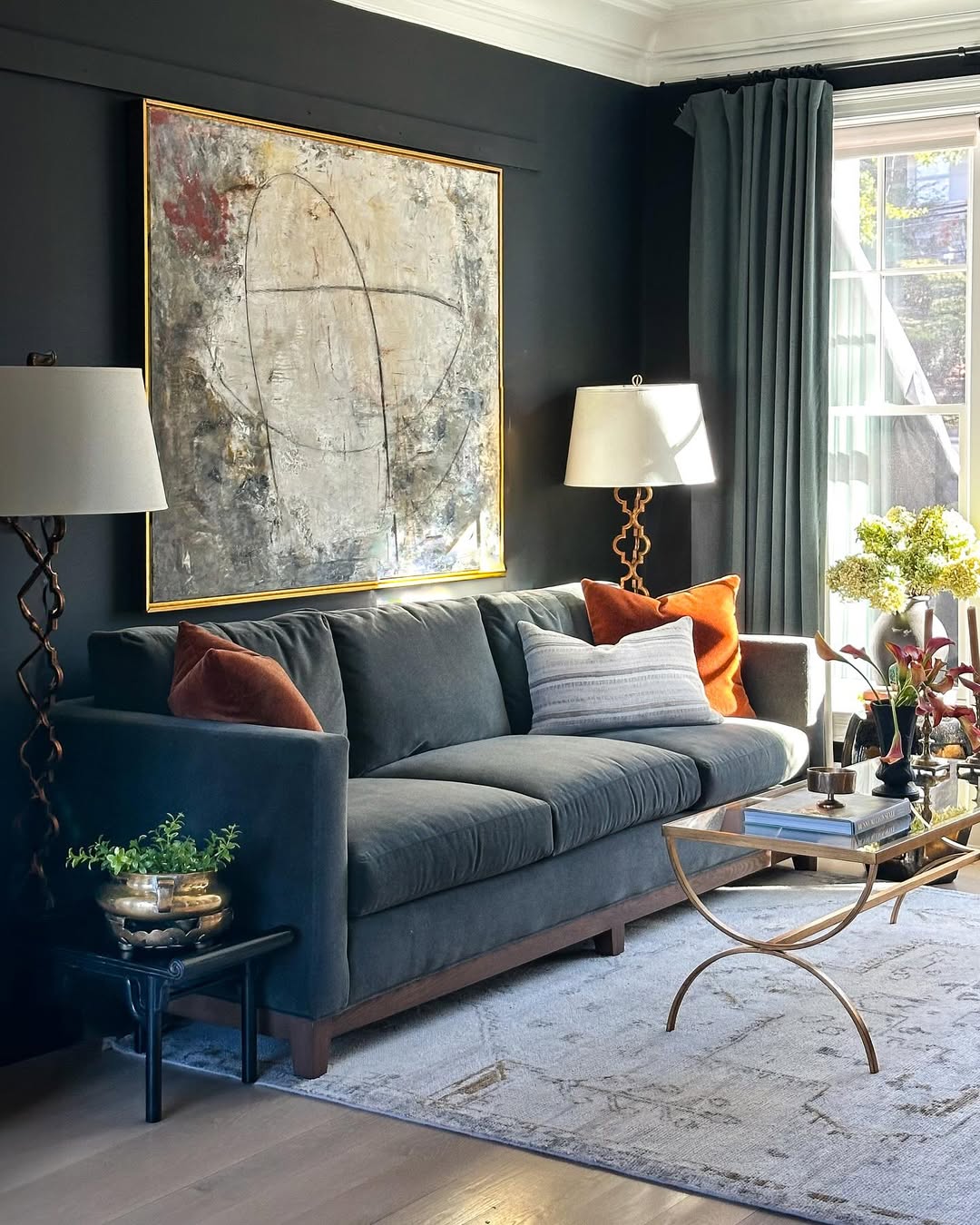 Abstract Art Anchors a Moody Living Room Palette