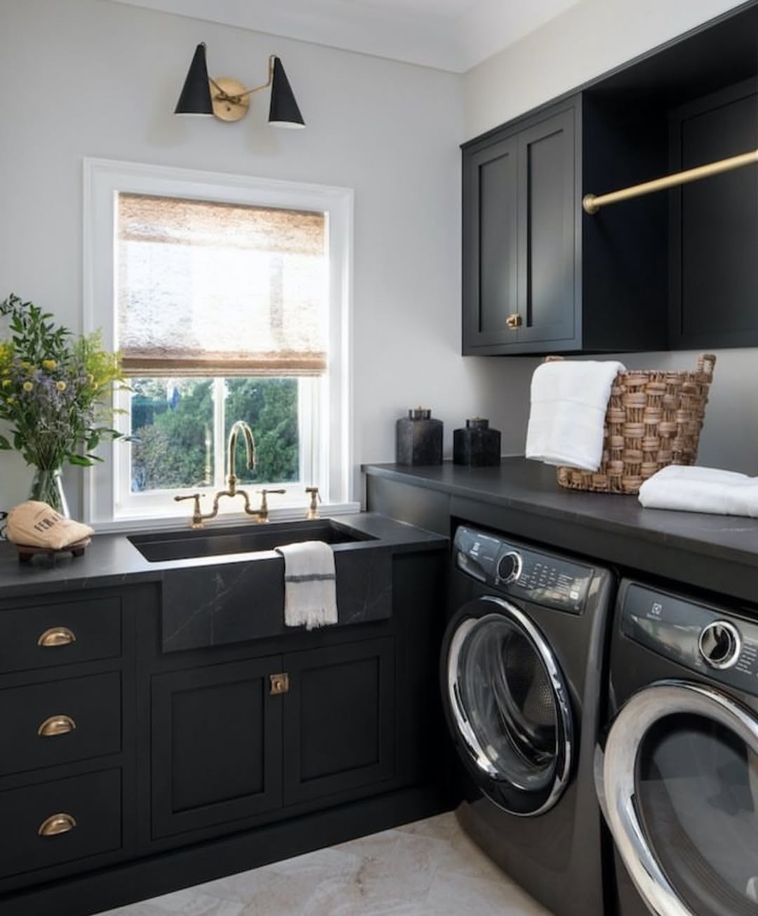 Black Cabinets With Brass Rod for Hanging Clothes