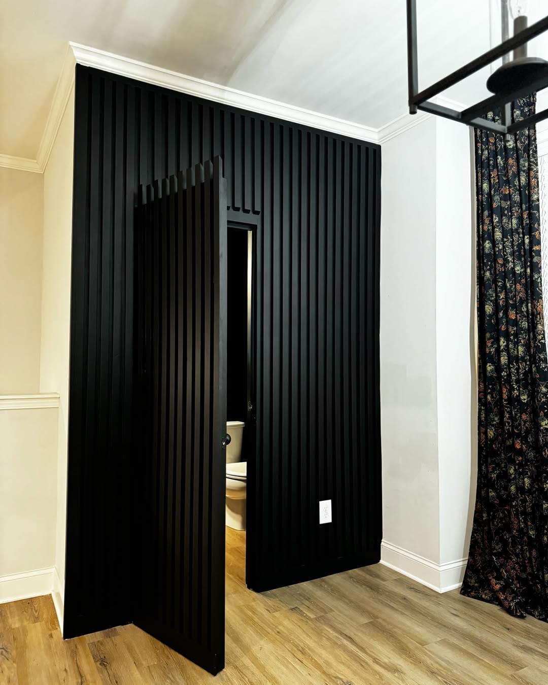 Vertical Slat Wall Conceals a Hidden Entryway